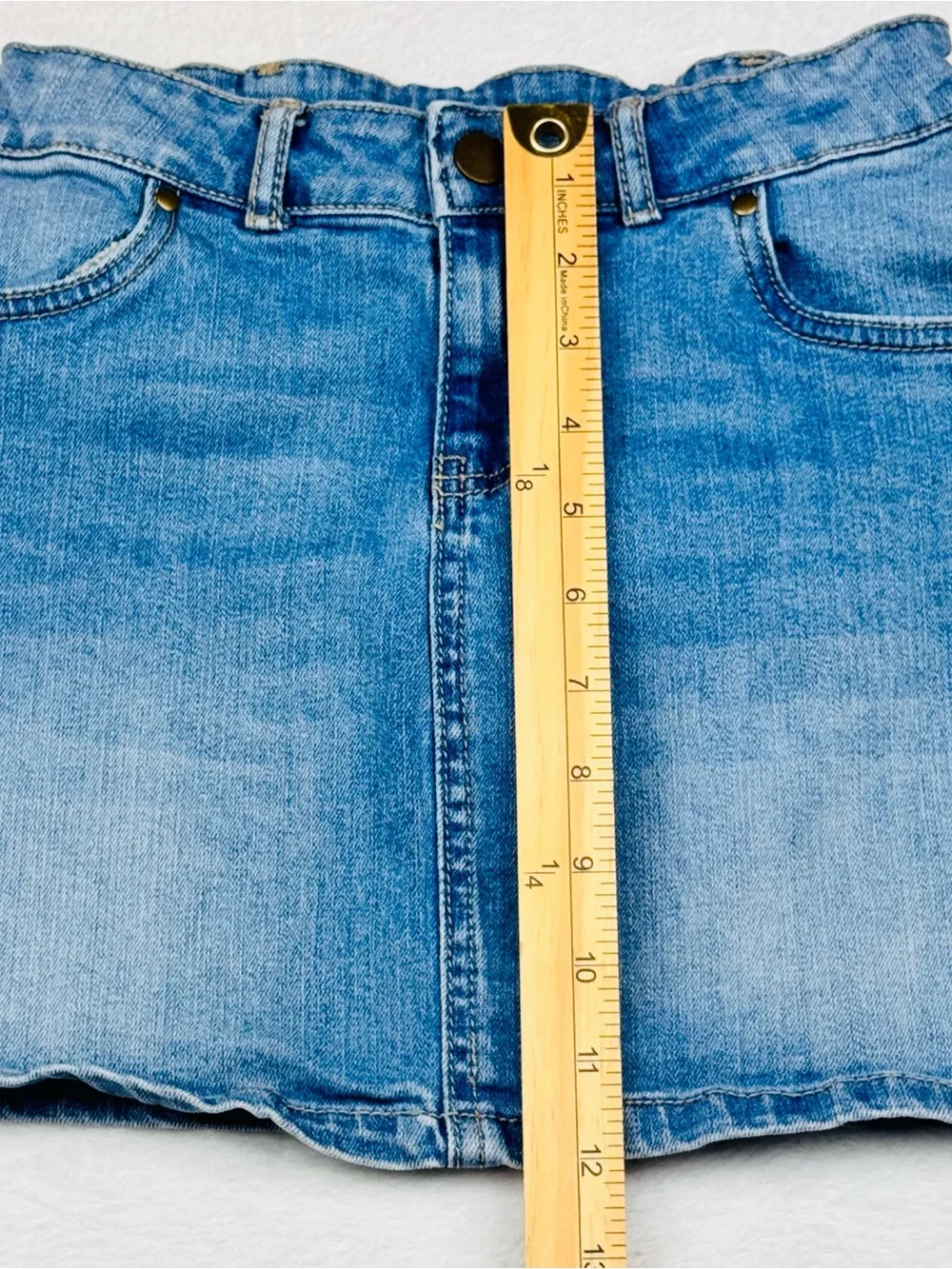Lot of 2 girls denim skirts. The blue shirt is a size 8, black skirt is size 7/8